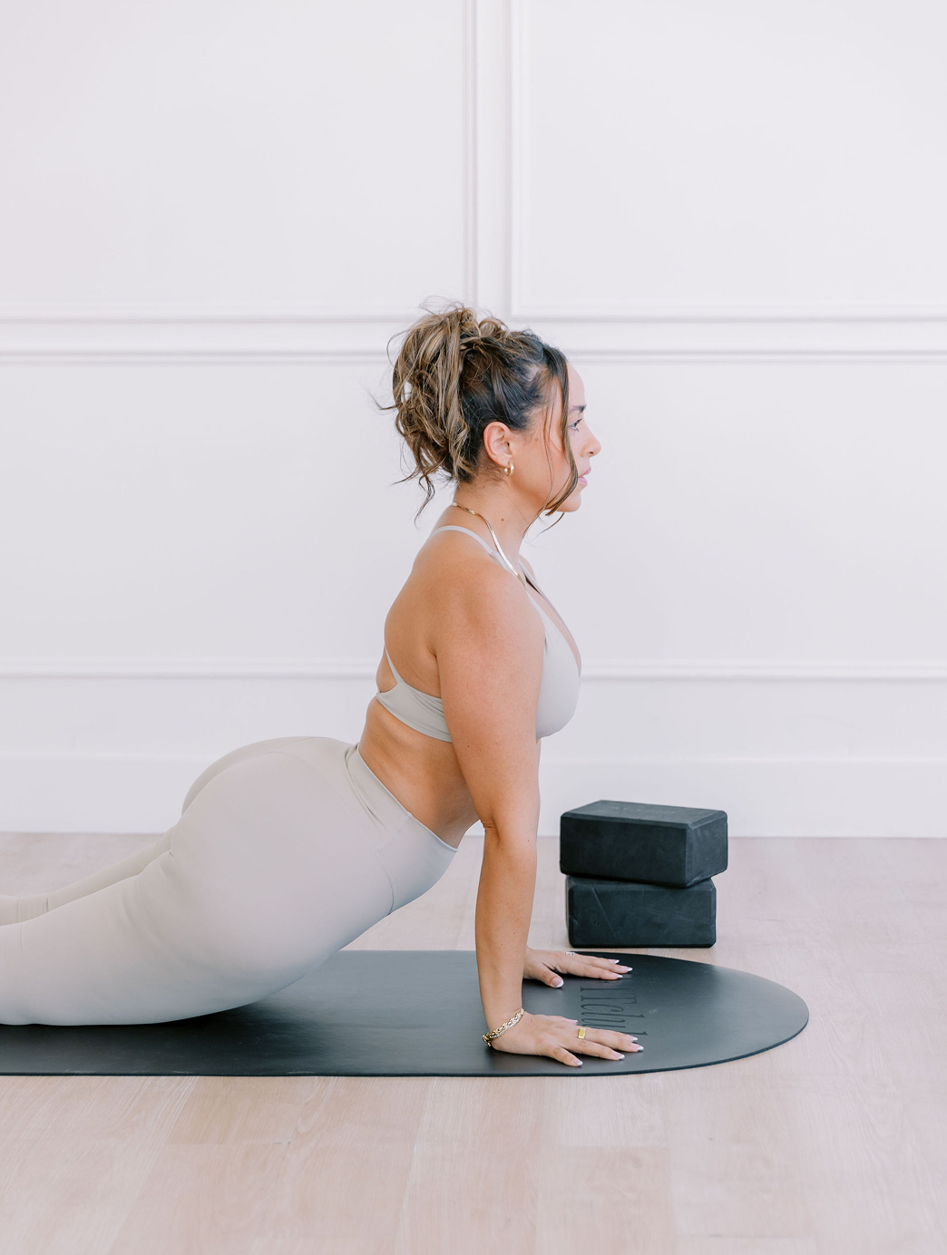 Woman on a yoga mat practicing yoga and Pilates. 